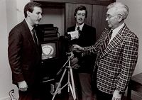 Jim Westmoreland and Others Looking at a Video Camera